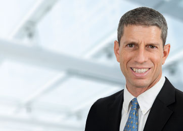 a man in a suit smiling