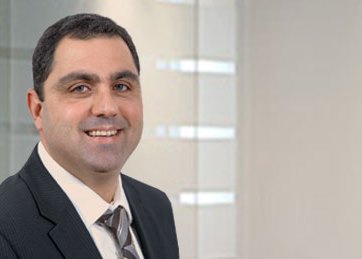 a man in a suit smiling